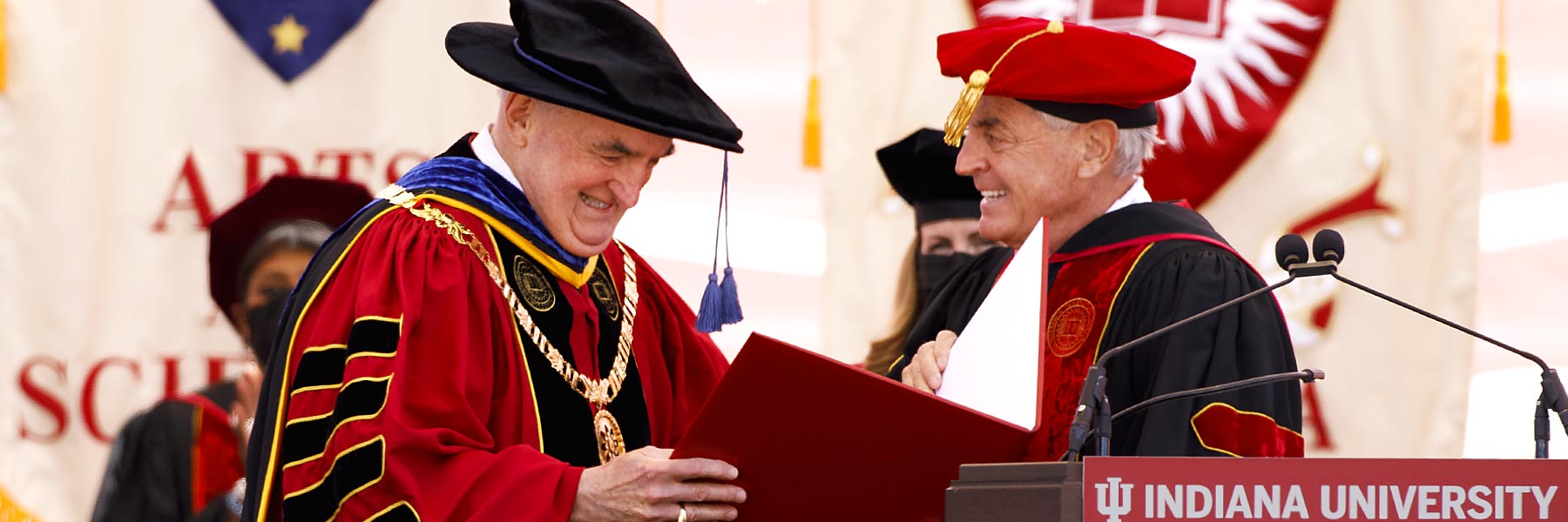 Michael McRobbie being honored at commencement