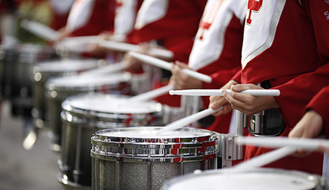 Members of the Marching Hundred play snare drums in the IU Bloomington Homecoming parade.