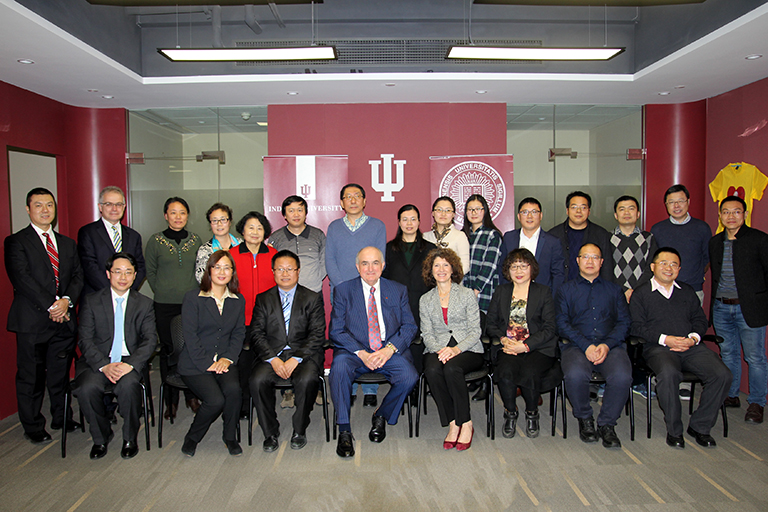 IU President McRobbie and members of the delegation with participants at the Ostrom Symposium at ...