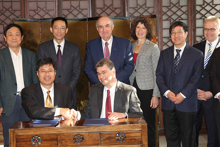 
IUPUI School of Engineering Dean David Russomanno, seated right, and Tsinghua University Vice P...