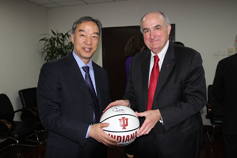 Beijing Normal University Professor Liu Baocun and IU President Michael A. McRobbie pose for a pi...