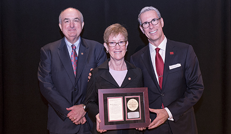 IU President Michael A. McRobbie poses for a photo with Jonlee Andrews and Dan Smith, who were am...