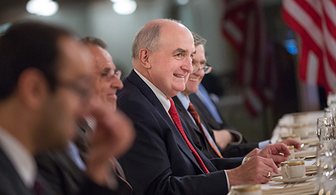 IU President Michael A. McRobbie reacts to a comment made during the lunch meeting in honor of Hi...