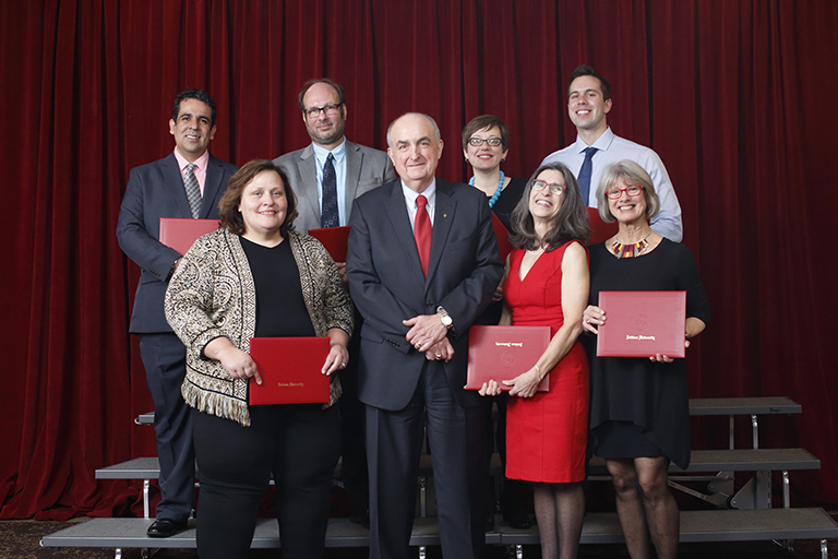 IU President Michael A. McRobbie, center, poses with the 2017 Celebration of Outstanding Faculty ...