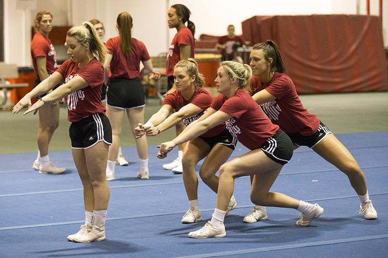 IU's Crimson Squad cheerleaders practice during IU President Michael A. McRobbie's visit. With on...