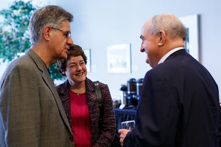 IU President Michael A. McRobbie talks to guests during the reception following the IUPUI Disting...