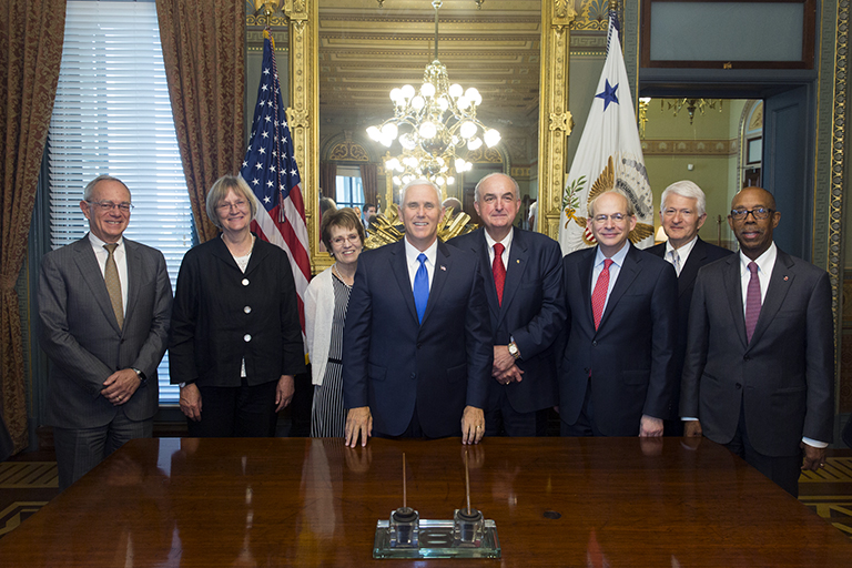 U.S. Vice President Mike Pence, center left, and IU President Michael A. McRobbie, center right, ...