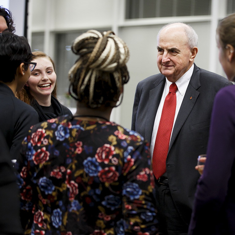 IU President McRobbie talks with a group of students