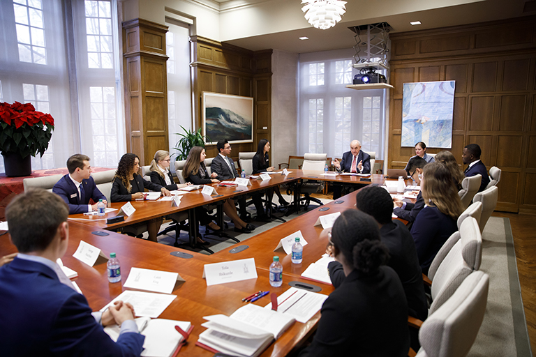 IU President McRobbie talks with members of the Board of Aeons during their mid-year presentation...