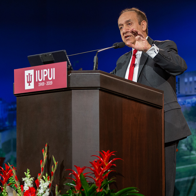 IUPUI Chancellor Nasser Paydar speaks from behind a podium