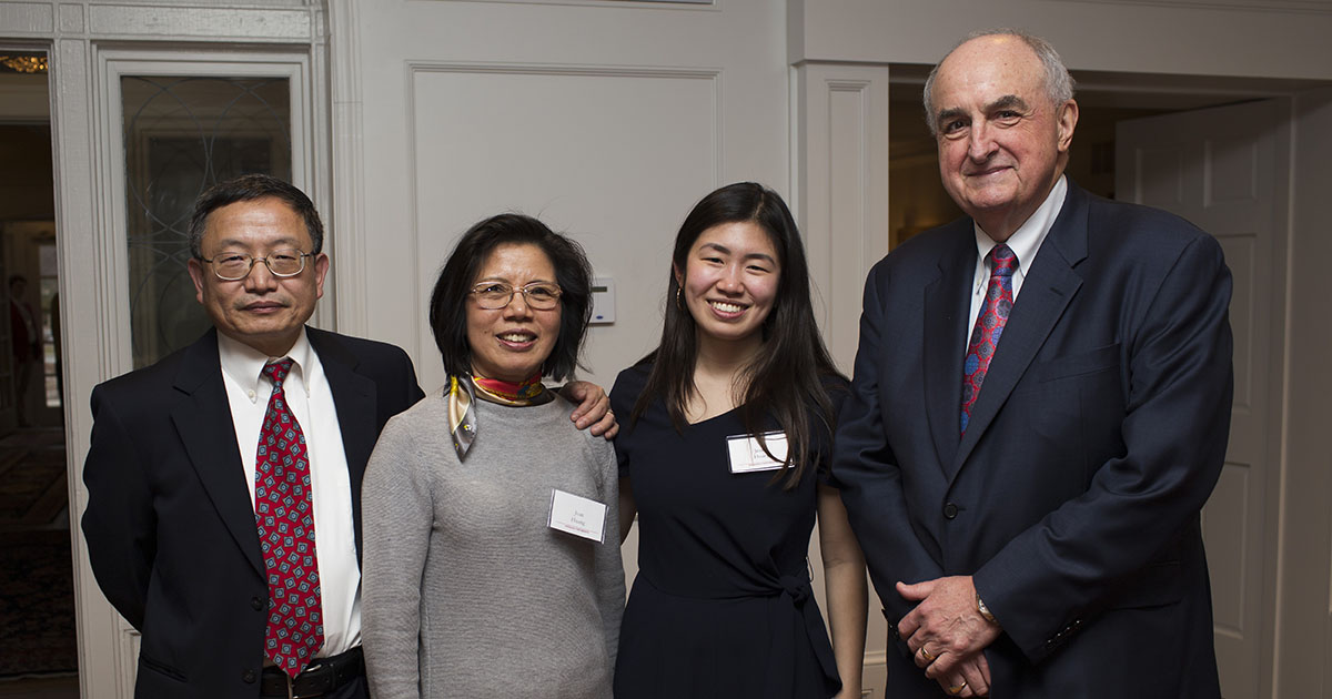 Jenny Rhodes stands with her family and IU President McRobbie