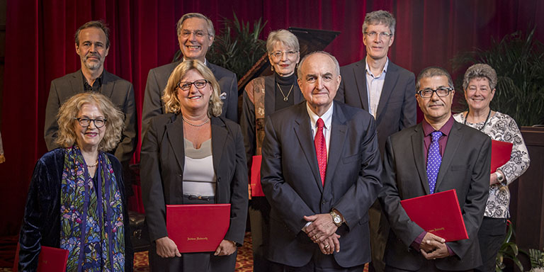 IU President McRobbie stands with eight of the distinguished professors