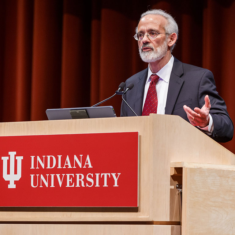 Michael Econs speaks from behind a podium