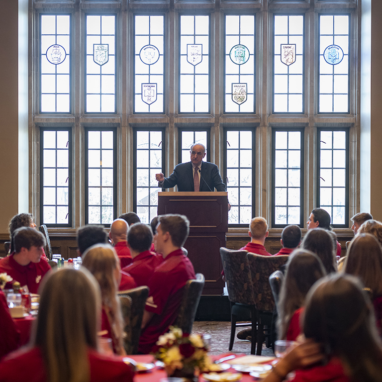 IU President McRobbie speaks to athletes gathered at tables