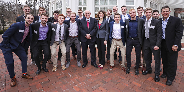 IU President and First Lady McRobbie stand with the IU men's soccer team