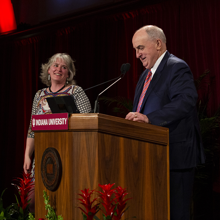 IU President McRobbie speaks next to award recipient Cathrine Reck